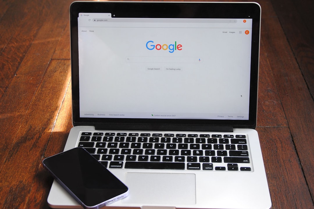 Small business owner reviewing rising website traffic and SEO performance on a laptop dashboard with charts, search rankings, and lead metrics in a modern office